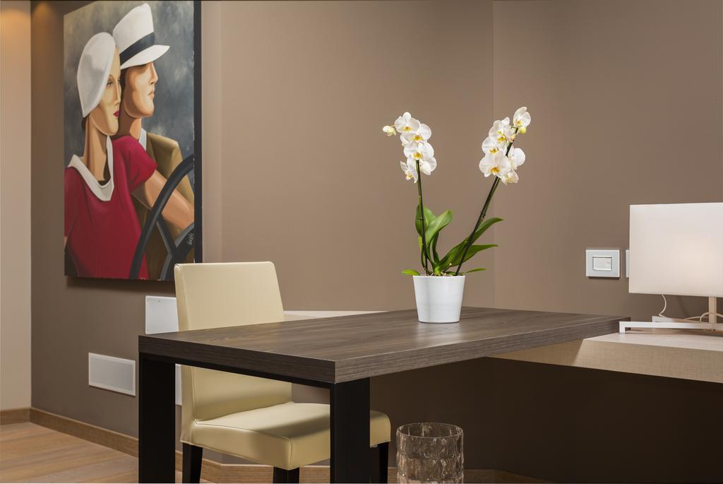Suites Hotel Astor Belluno Quarto foto