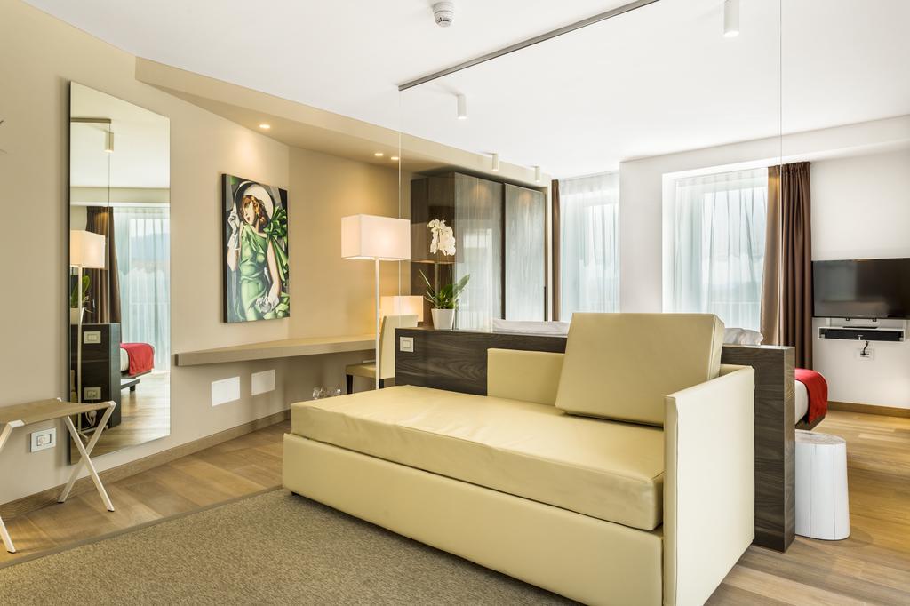 Suites Hotel Astor Belluno Quarto foto